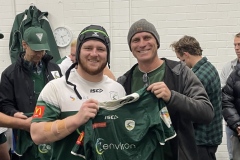 Brad Drelincourt of Fadrel handing jersey to Nick Ball