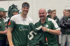 Luke Tresidder of Maxwell Recruitment handing jersey to Brendan Jackson