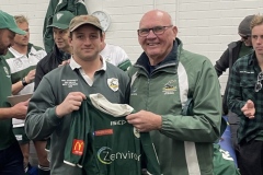 Paul Murphy of Churchills Carpet Court handing jersey to Will Mansfield