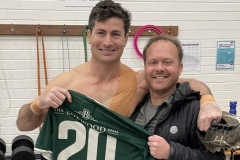 Tim Woolf of Colliers handing jersey to Michael Dan