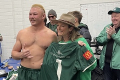 Nadene Barretto of Eight Recruitment handing jersey to Dave Puchert